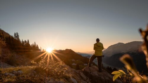 Hiker Watching Golden Mountain Sunset 4K Desktop Wallpaper