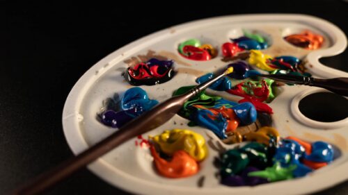 Colorful Artist Paint Palette with Brushes 4K Desktop Wallpaper