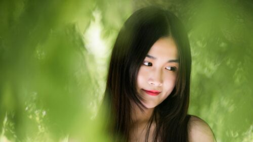 Beautiful Asian Girl with Long Black Hair Soft Bokeh Green Nature 4K Desktop Wallpaper