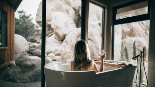 Woman Relaxing in Modern Bathtub Desert View Desktop Wallpaper
