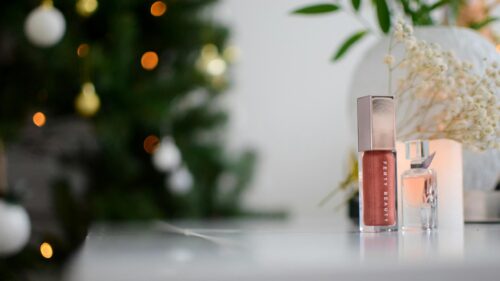 Elegant Fenty Beauty Lip Gloss and Mini Perfume Bottle Desktop Wallpaper