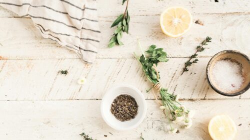 Rustic Herbal Ingredients Flat Lay on Distressed Wood Desktop Wallpaper