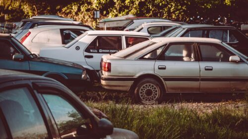 Vintage Sedans Parked in Golden Hour Light Desktop Wallpaper