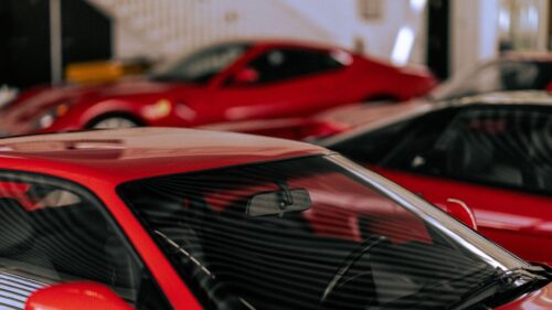 Classic Ferrari Red Sports Cars in a Luxury Garage 4K Wallpaper