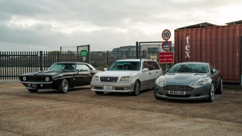 Classic and Modern Sports Cars Parked Outdoors 4K Wallpaper