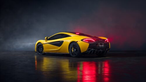 Hyper Realistic Luxury Sports Car Driving on Mountain Road Sunset 4K Desktop Wallpaper