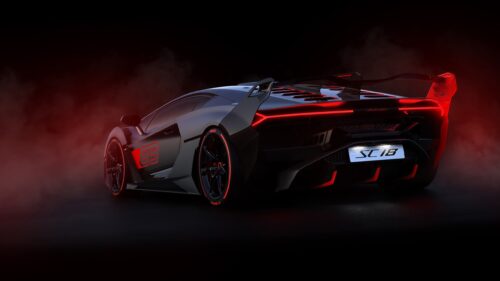 Stunning Luxury Sports Car Speeding on Coastal Highway at Sunset 4K Desktop Wallpaper