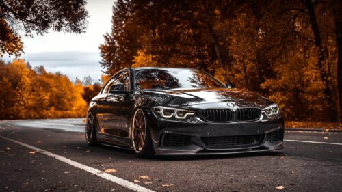 Hyper Realistic Luxury Sports Car Driving on Mountain Road Sunset 4K Desktop Wallpaper