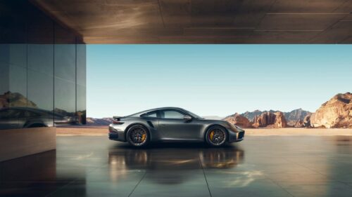 Hyper Realistic Luxury Sports Car Driving on Mountain Road Sunset 4K Desktop Wallpaper