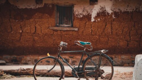 Vintage Bicycle Against Rustic Mud Wall Desktop Wallpaper