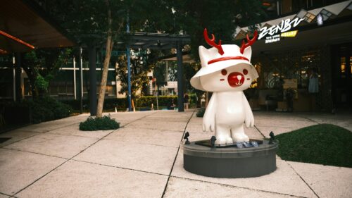 Cute White Deer Character Sculpture in Modern Park 4K Desktop Wallpaper