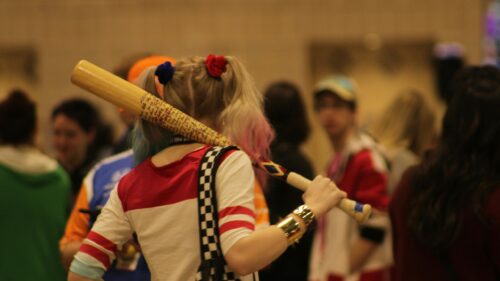 Harley Quinn Cosplayer with Baseball Bat Behind the Scenes 4K Wallpaper
