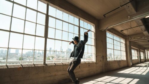 Man Dancing in Industrial Urban Loft with City View 4K Wallpaper