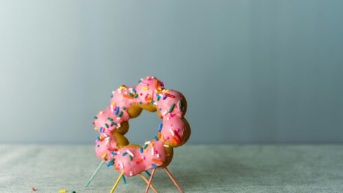 Pink Sprinkled Mochi Donut on Toothpicks 4K Desktop Wallpaper