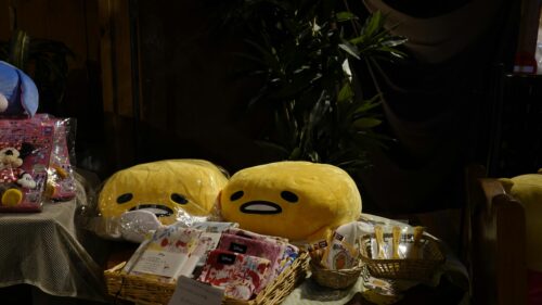 Cute Gudetama Plushies and Disney Collectibles Desk Setup 4K Wallpaper