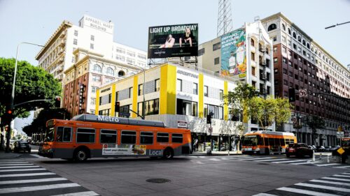Orange Los Angeles Metro Bus on Busy Broadway Street Desktop Wallpaper