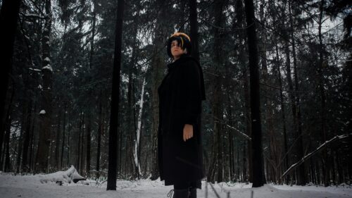 Cosplay Character in Dark Snowy Winter Forest Desktop Wallpaper