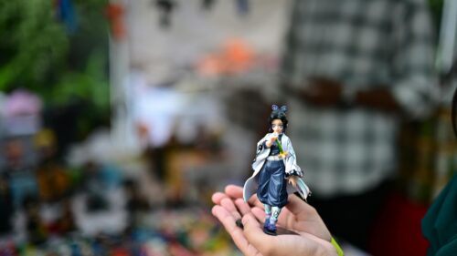 Shinobu Kocho Anime Figure Held in Hands 4K Wallpaper