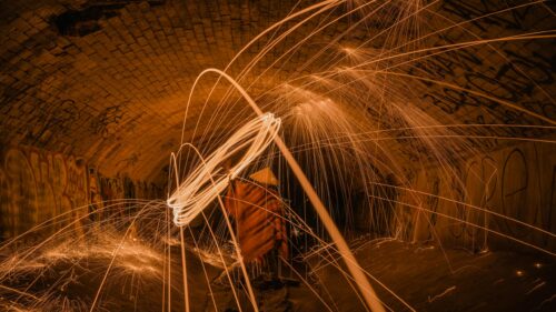Fiery Steel Wool Light Painting in Tunnel 4K Wallpaper