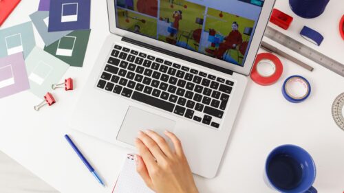 Graphic Design Workspace with Laptop and Color Swatches Desktop Wallpaper