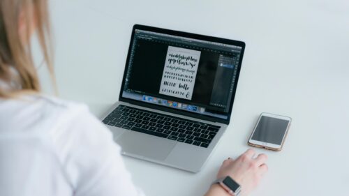 Creative Graphic Designer Workspace with Adobe Photoshop Desktop Wallpaper