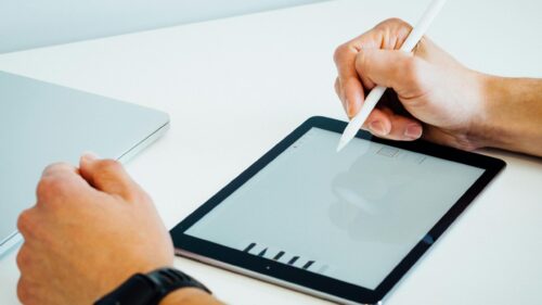 Digital Artist Working on Tablet Creative Design 4K Wallpaper