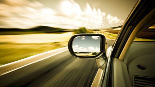 POV Driver Seat View of Scenic Mountain Road at Sunset 4K Desktop Wallpaper