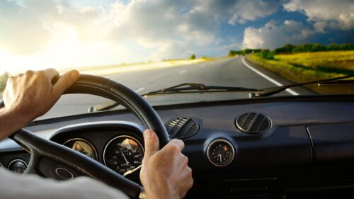 POV View from Inside a Driver Education Car on a Sunny Road 4K Wallpaper