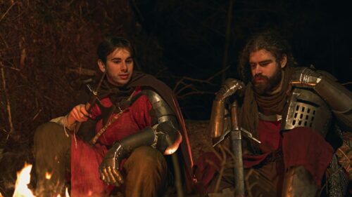 Two Medieval Knights Resting by a Campfire 4K Desktop Wallpaper