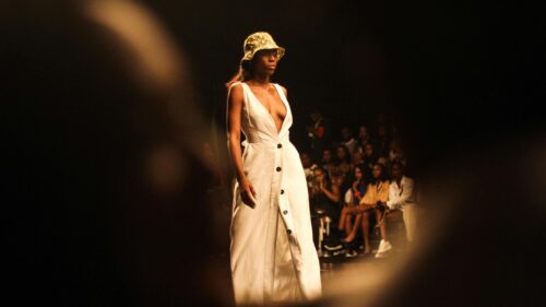 Model Walking Fashion Runway in White Dress 4K Desktop Wallpaper