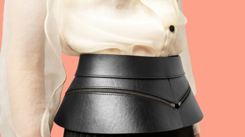 Elegant Black Leather Peplum Corset Belt Over Sheer White Blouse 4K Wallpaper