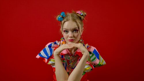 Fashionable Girl with Artistic Makeup and Colorful Outfit Desktop Wallpaper