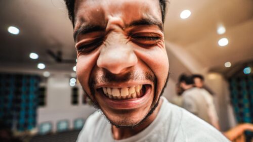 Funny Close Up Face Grimacing Man High Definition PC Wallpaper