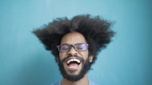 Funny Man with Big Afro Laughing Out Loud 4K Desktop Wallpaper