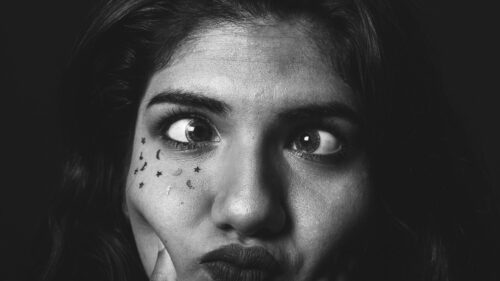 Black and White Portrait of Expressive Woman with Celestial Stickers Desktop Wallpaper