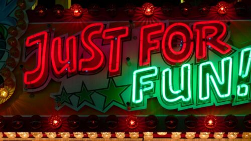 Neon JUST FOR FUN Carnival Sign 4K Desktop Wallpaper
