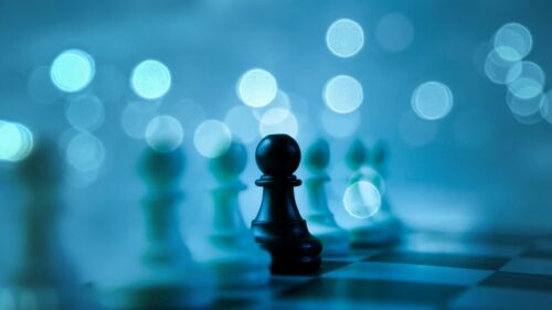 Black Pawn Among White Pieces Strategy Game 4K Wallpaper