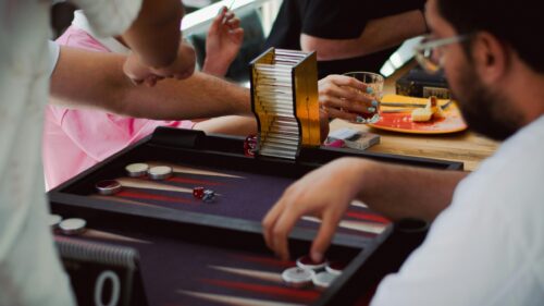 Friends Playing Backgammon at a Cafe Table Desktop Wallpaper