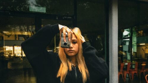 Aesthetic Blonde Girl Holding Retro Film Camera Desktop Wallpaper