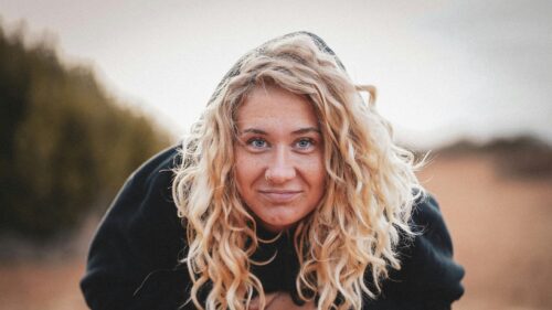 Curly Blonde Girl Wearing Black Hoodie Portrait 4K Wallpaper