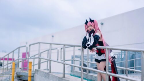 Anime Cosplay Girl with Pink Hair on Metal Railing Desktop Wallpaper
