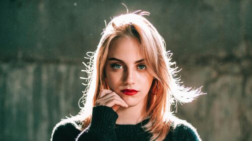 Stunning Blonde Girl with Piercing Blue Eyes Portrait 4K Wallpaper