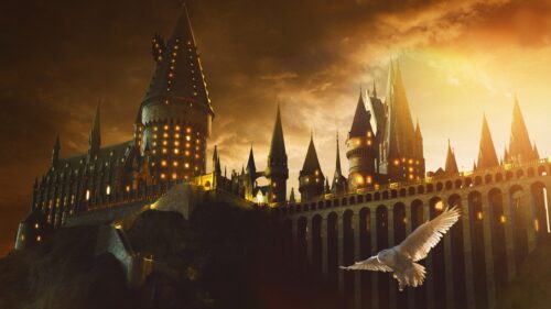 Magical Hogwarts Castle at Night with Glowing Lights 4K Desktop Wallpaper