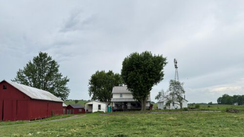 Rustic Farmhouse Landscape with Red Barn and Windmill Desktop Wallpaper