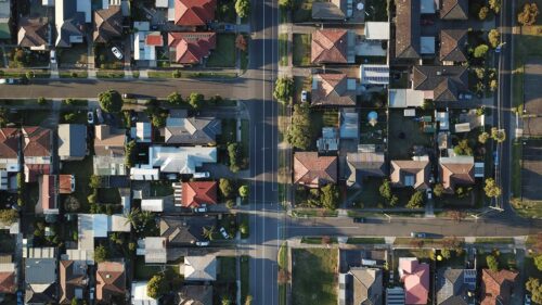 Aerial View of Suburban Neighborhood Streets and Houses 4K Wallpaper