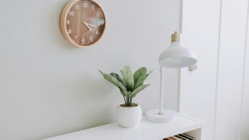 Minimalist Desk Decor with Potted Plant and Modern Lamp 4K Wallpaper