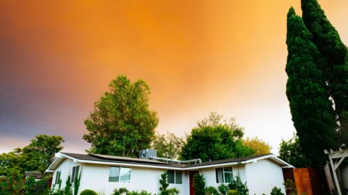 Stunning House Under Dramatic Orange Smoke Filled Sky Desktop Wallpaper