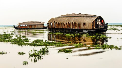 Serene Kerala Houseboats on Calm Backwaters Desktop Wallpaper