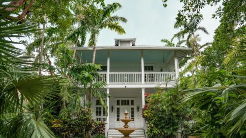 Tropical Colonial House with Lush Garden and Fountain 4K Wallpaper