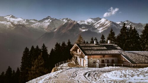 Alpine Mountain Cabin in Winter Snowy Landscape 4K Wallpaper